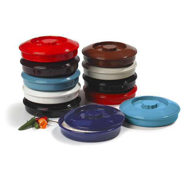 A stack of red Carlisle tortilla servers with interlocking lids.