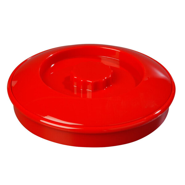 a red plastic lid with a nut
