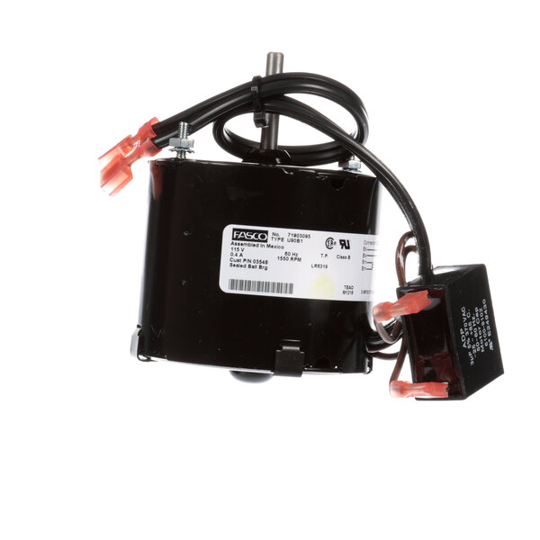 A close-up of a Norlake evaporator motor with wires and a wire harness.