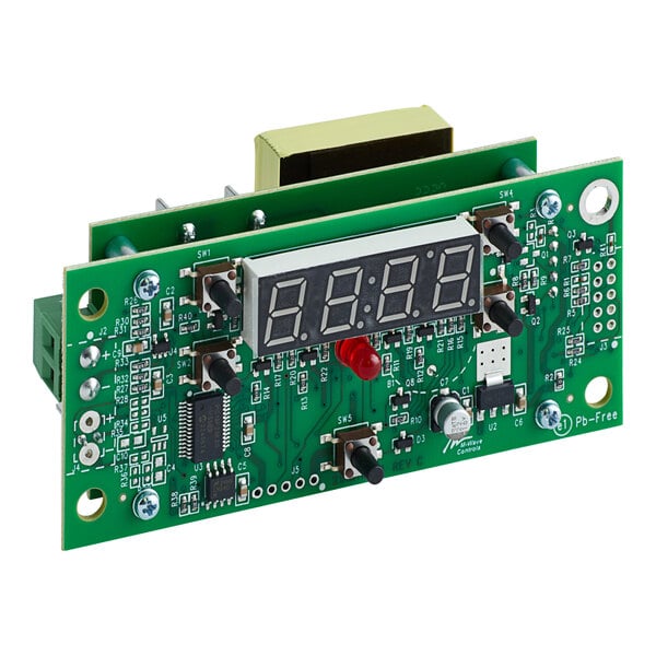 A green circuit board with a digital clock display.