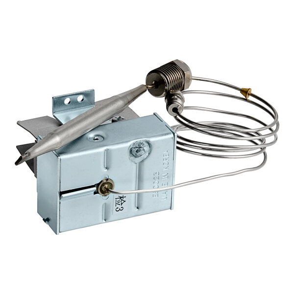 A metal thermostat with a wire attached to it.