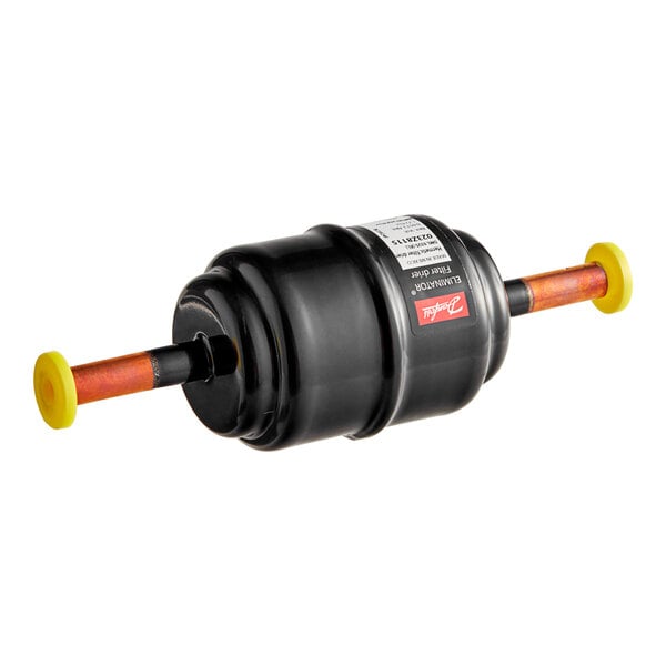 A black plastic cylinder with yellow handles and a white label.