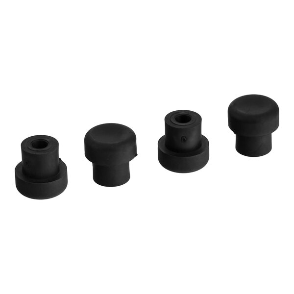 A set of four black rubber feet for a Vitamix blender.