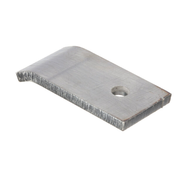 A close-up of a Groen retainer, a metal piece with a hole.