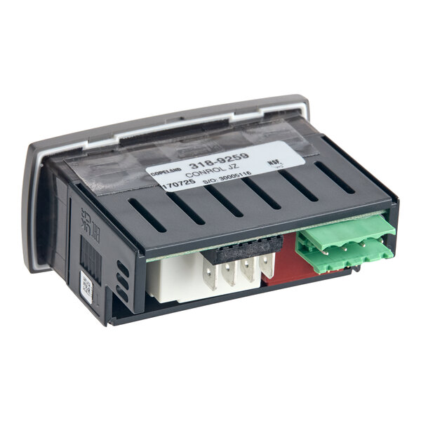 A rectangular electronic device with a black casing, visible connectors, and a label on top, featuring green and white terminal blocks.