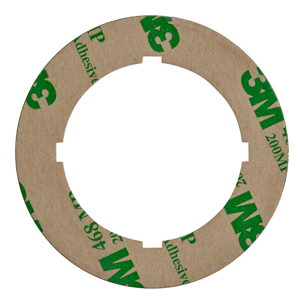 A circular US Range dial insert with green and brown text.