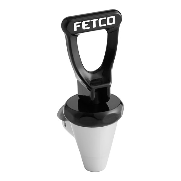 A black and white Fetco faucet assembly with white text on the handle.