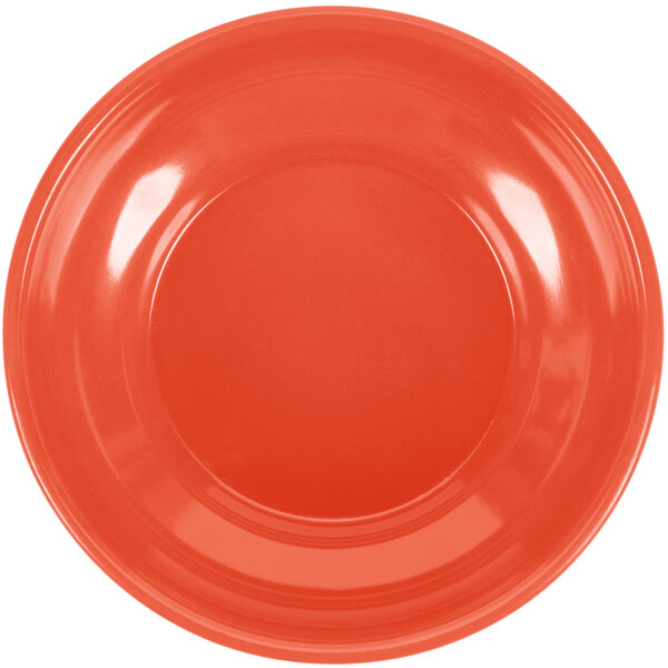 A close-up of a red GET Rio Orange salsa dish.