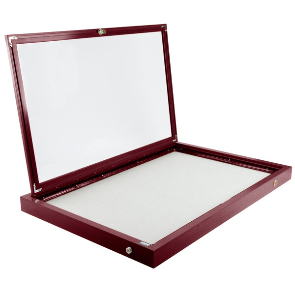 A rectangular cherry wood bulletin board cabinet with a white cover.