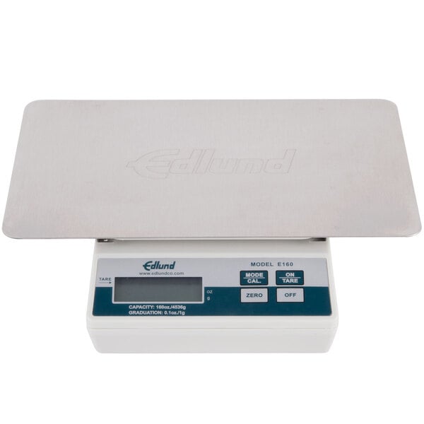 An Edlund white electronic portion scale with blue and grey buttons.