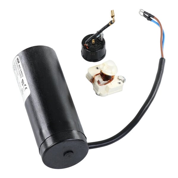 A True Refrigeration 884908 start component kit for model T6215z, including a black cylindrical capacitor, relay, and overload protector.