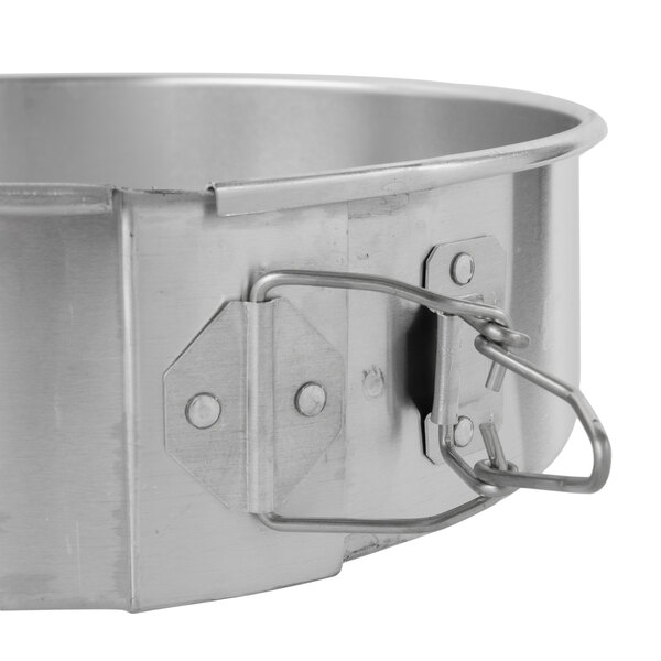 A Chicago Metallic aluminum springform cake pan with a latch.
