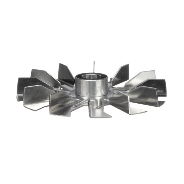 A metal fan blade with a hole.