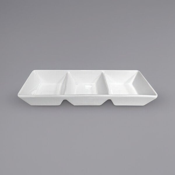A white rectangular China tasting bowl with three compartments.