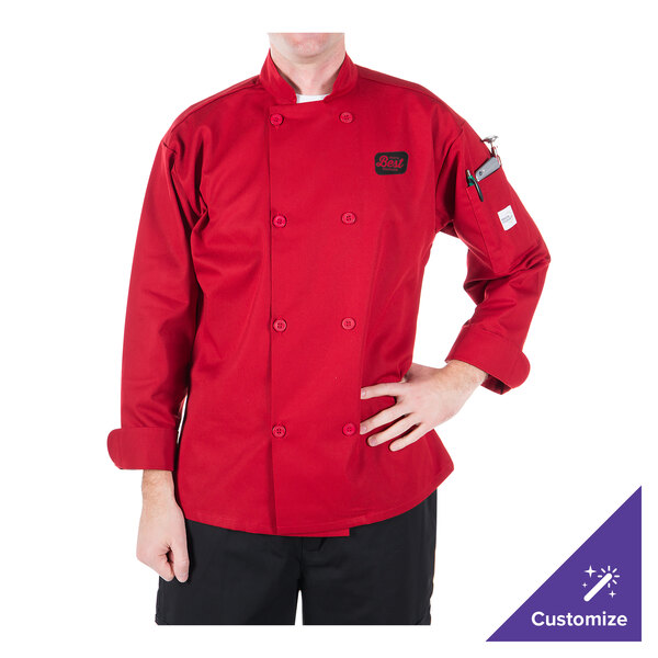 A person wearing a Mercer Culinary Millennia red long sleeve chef coat over a white shirt.