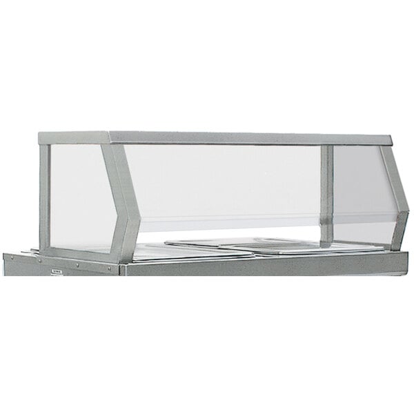 A stainless steel serving shelf on a counter.