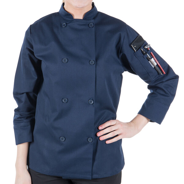 a woman wearing a blue chef coat