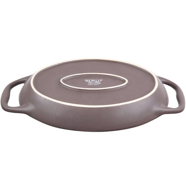 A brown Libbey stoneware oval baker with handles.