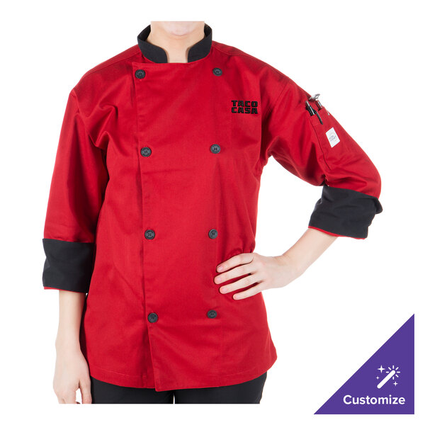 A person wearing a Mercer Culinary red chef jacket with customizable sleeves.