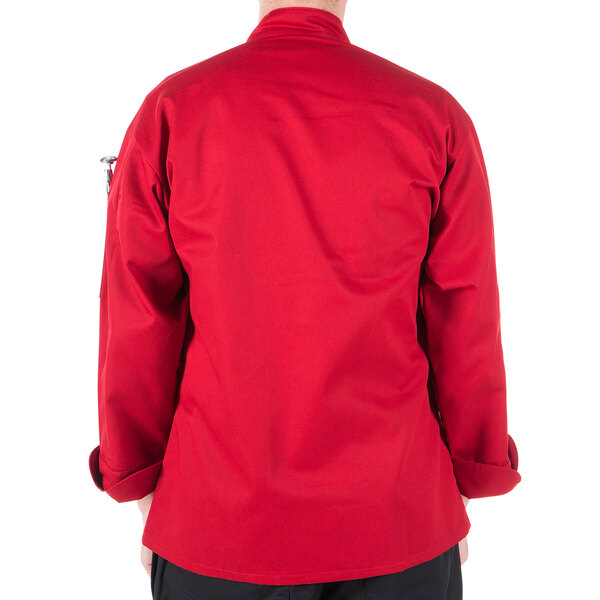 The back of a person wearing a Mercer Culinary Millennia red long sleeve cook jacket.