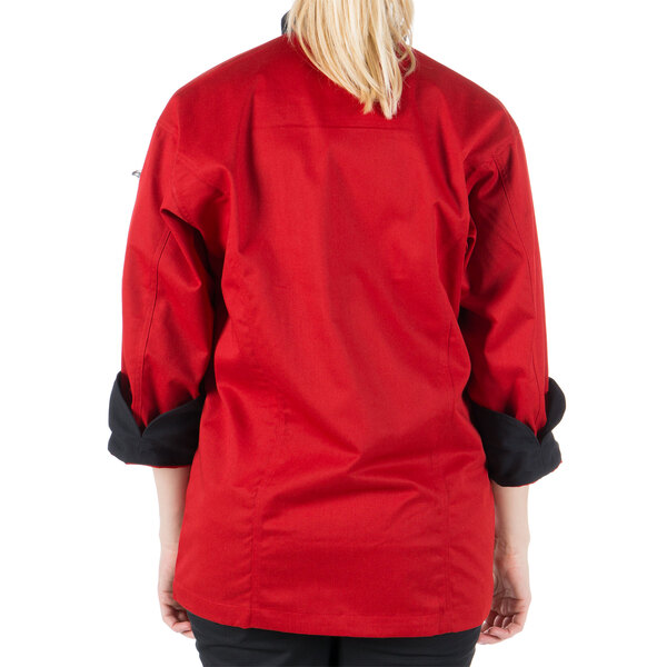 A woman wearing a Mercer Culinary red chef jacket.
