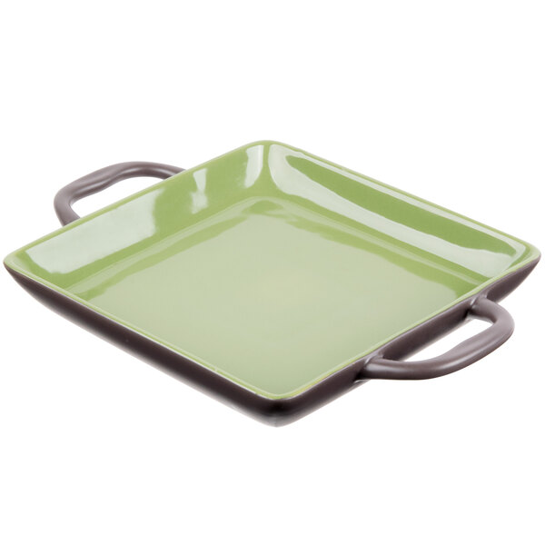 a green square plate with handles