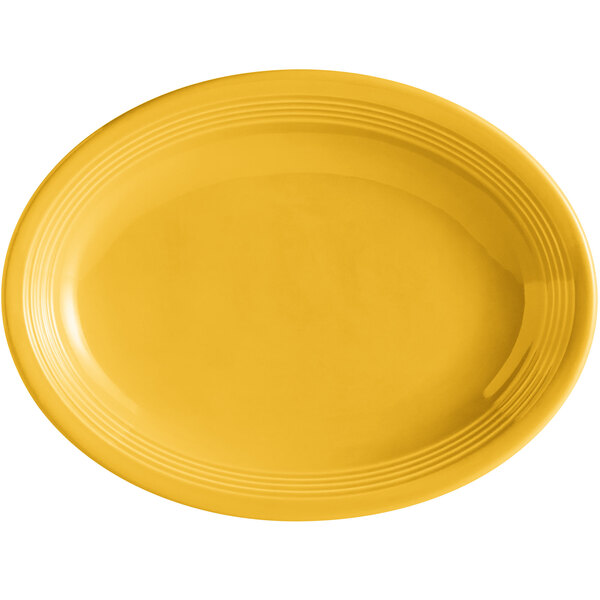 A yellow oval china platter with a white rim.