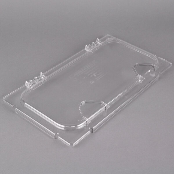 A clear plastic food pan lid with a notch.