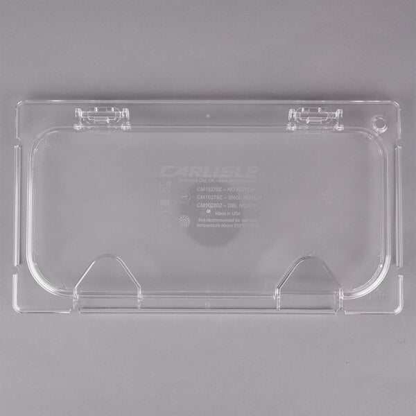 A clear plastic Carlisle food pan lid with a notch.