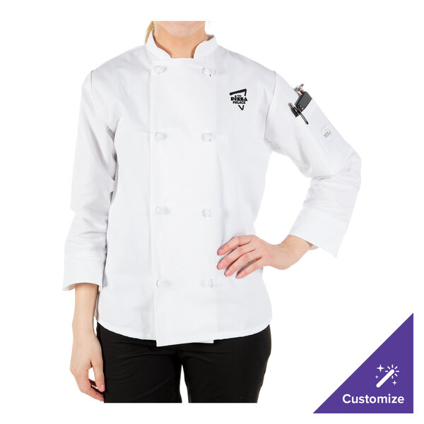 A woman wearing a white Mercer Culinary chef coat with knot buttons.