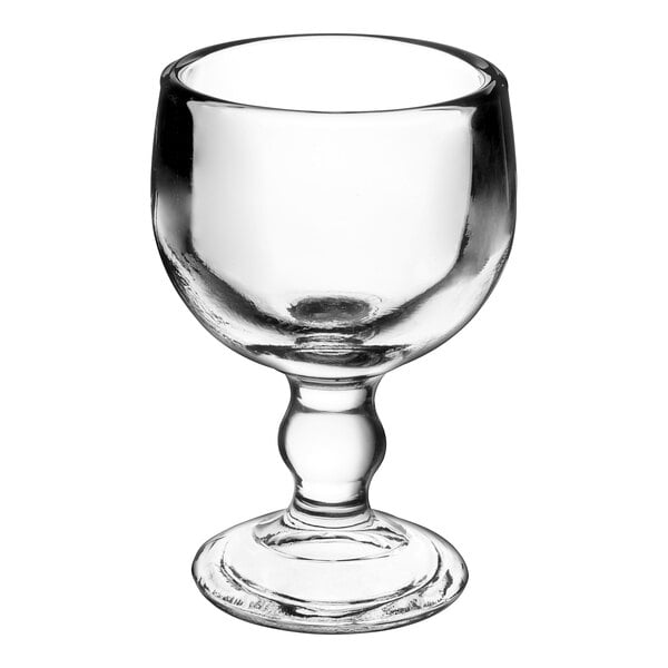 An Anchor Hocking clear schooner glass with a leg.