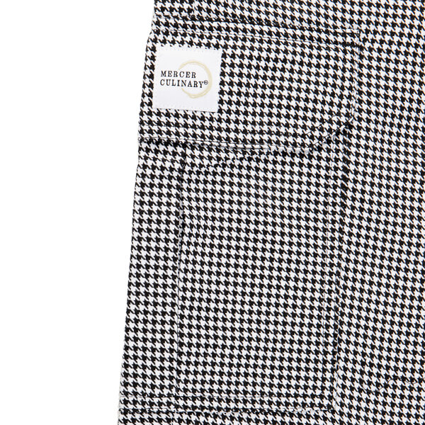 A close up of Mercer Culinary Genesis houndstooth cargo pants with a pocket.