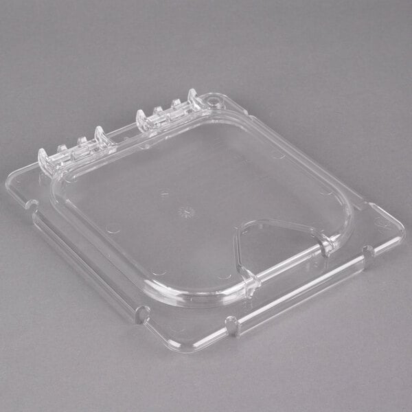 A clear plastic food pan lid with a notch.