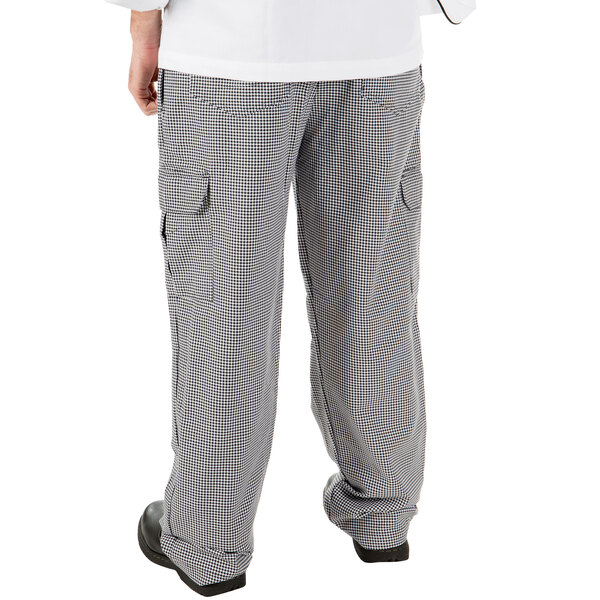 A person wearing Mercer Culinary Genesis Houndstooth Cargo Pants and a white shirt.