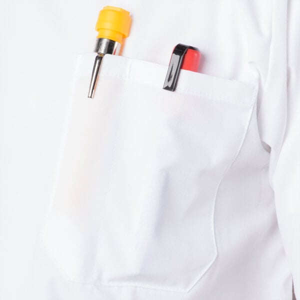 A white Mercer Culinary cook shirt with a pen in the pocket.