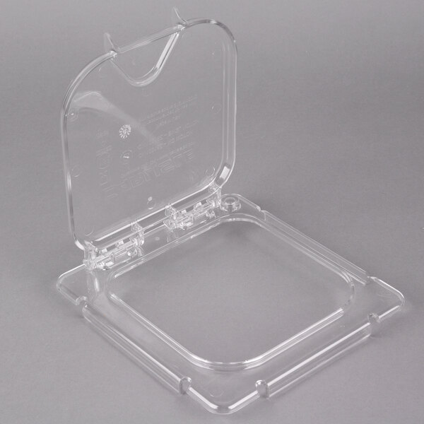 A clear plastic Carlisle food pan lid with a handle.