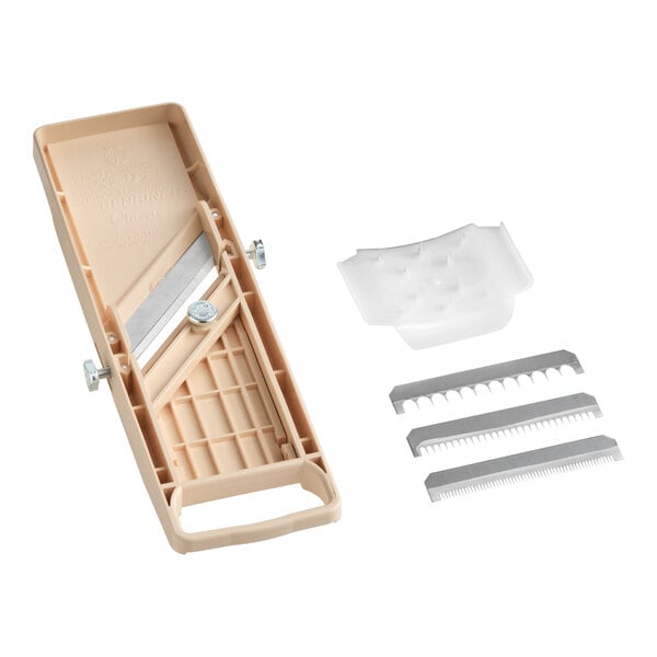 A beige Benriner "Little Beni" Japanese mandoline slicer with three interchangeable blades and a hand guard.