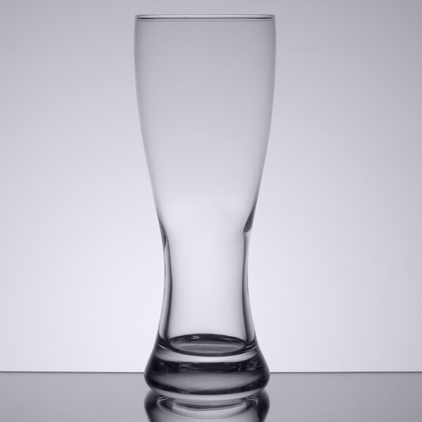An Anchor Hocking Pilsner glass on a table.