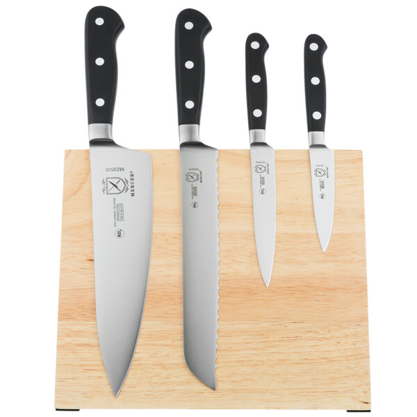 A Mercer Culinary Renaissance knife set on a wooden magnetic board.