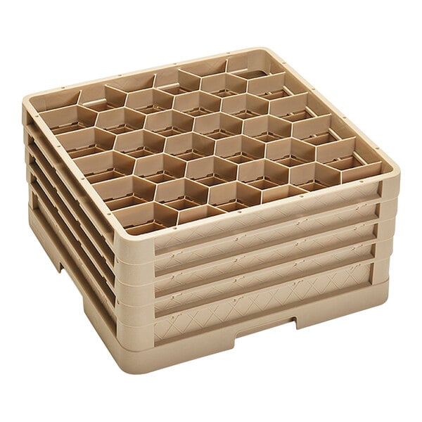 A beige plastic Vollrath Traex glass rack with closed walls and six compartments.