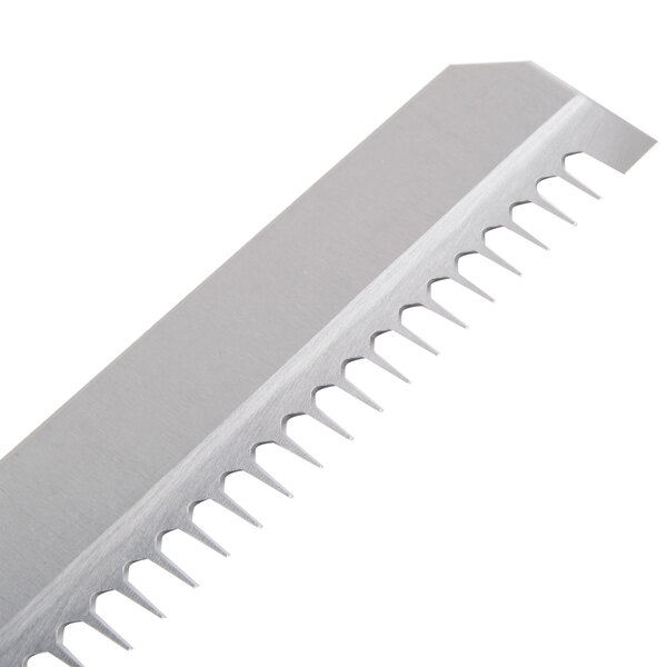 A close up of a Benriner 2 mm medium mandoline blade.