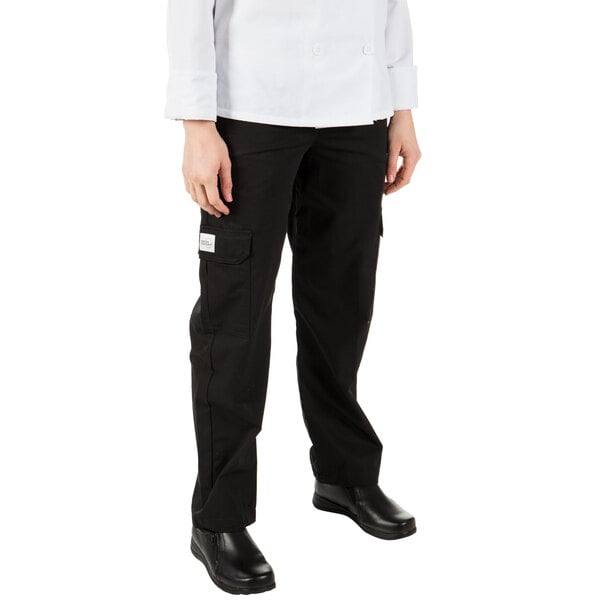 A woman wearing Mercer Culinary black cargo pants.