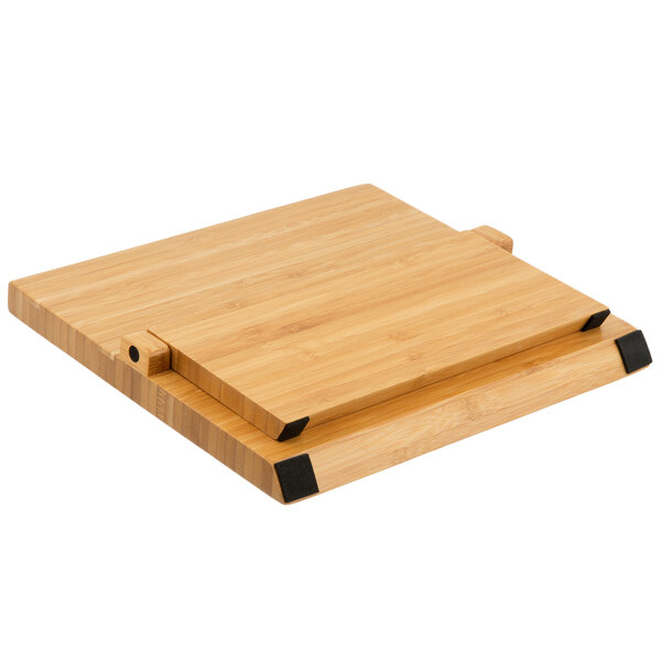 A Mercer Culinary bamboo knife board with a black handle.