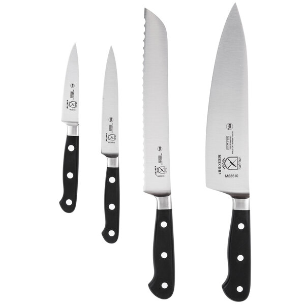 A white rectangular Mercer Culinary bamboo knife board with black text and three black-handled knives on it.