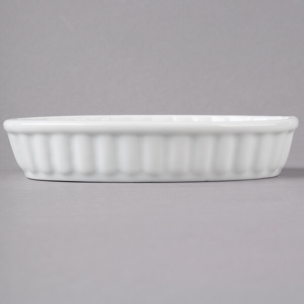 Acopa 6 oz. Oval Bright White Fluted Porcelain Souffle / Creme Brulee Dish 12/Pack