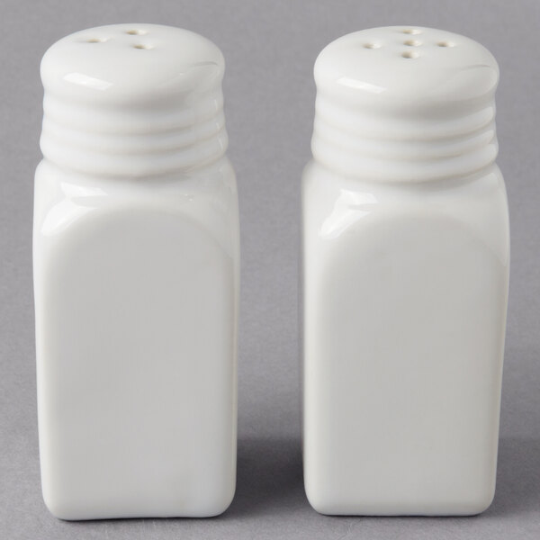 A white American Metalcraft salt and pepper shaker set.