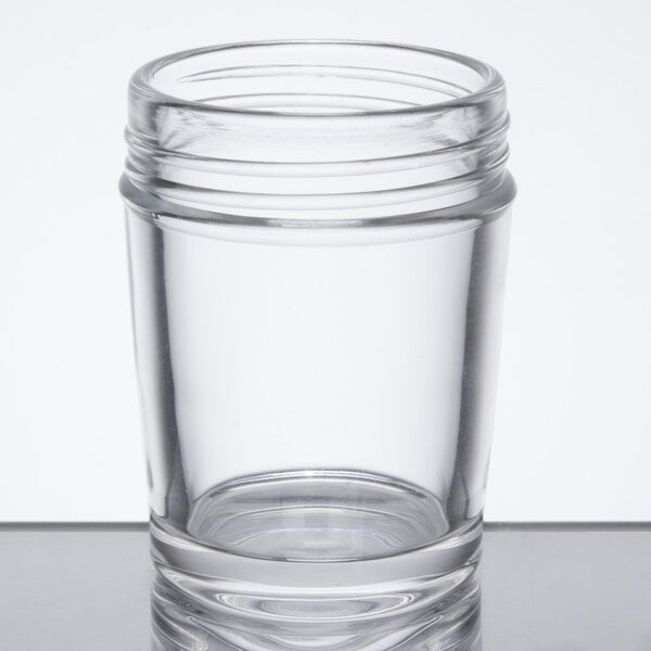 a clear glass with a lid