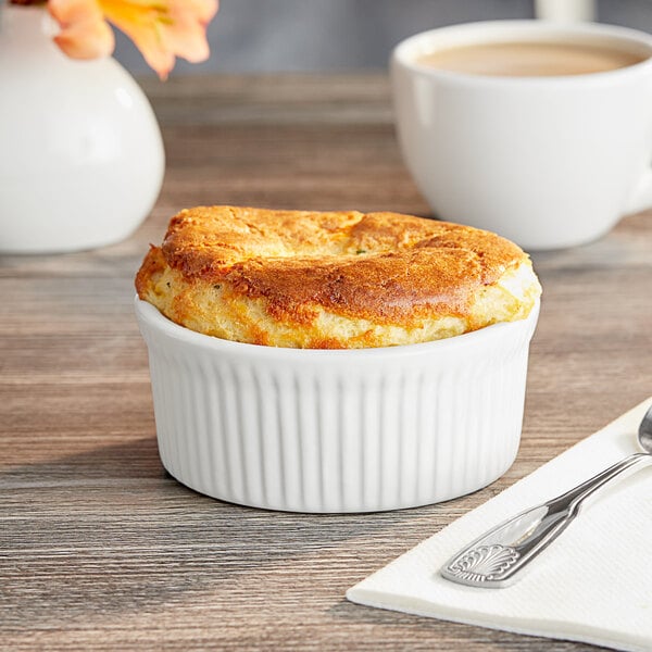 A white Acopa fluted porcelain dish with food in it.