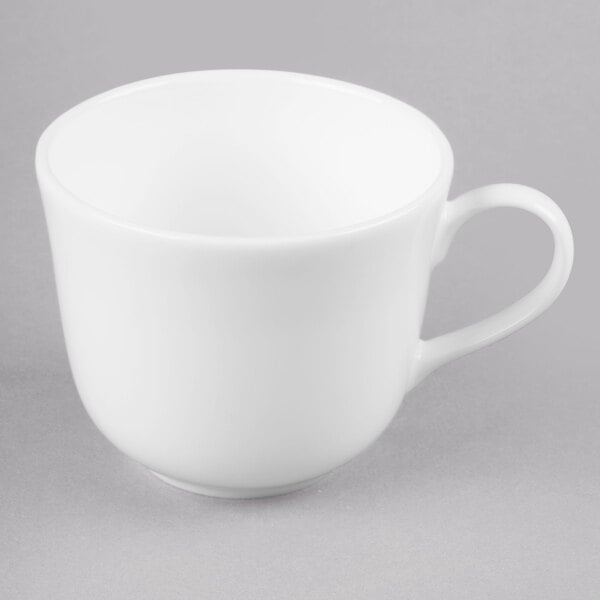 a white plate with a silver handle