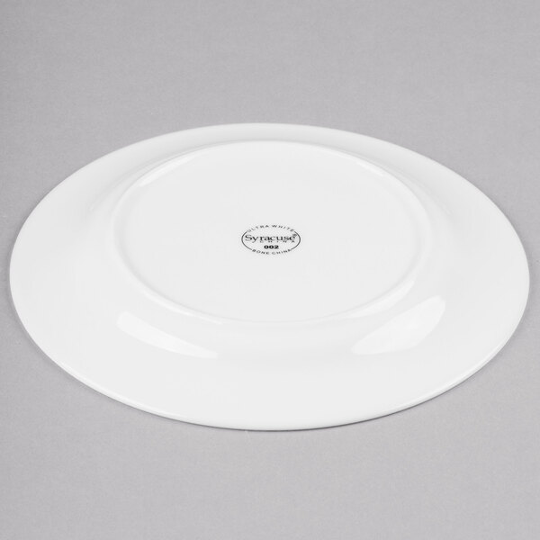A white Reserve by Libbey bone china side plate with a small circular design.